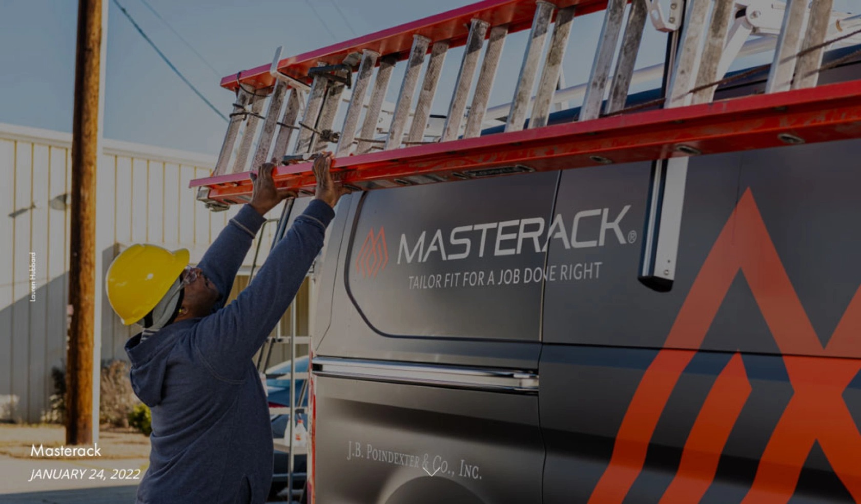 Loading a ladder on a van with a Masterack Ladder Rack